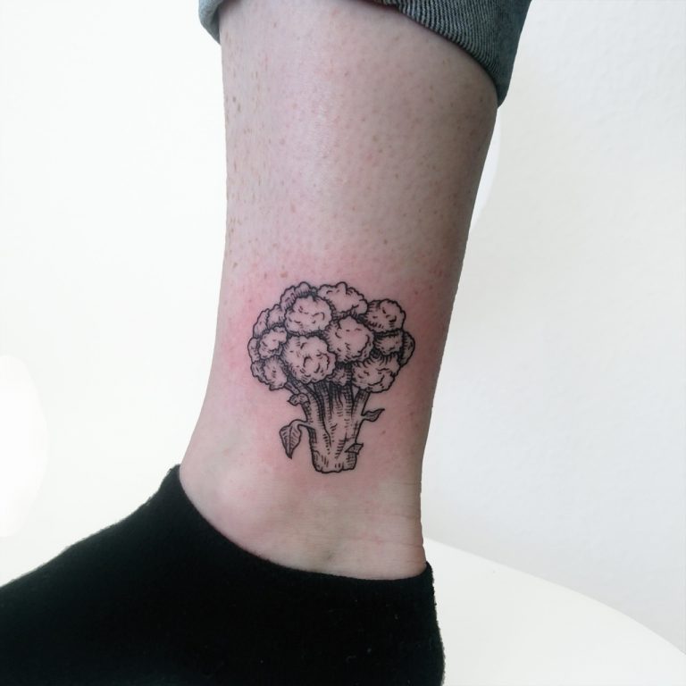 Woodcut tattoo of a broccoli