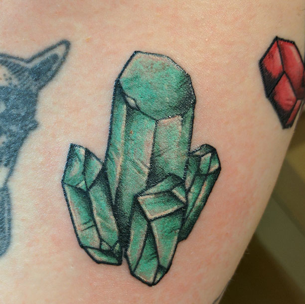 Tattoo of green turquoise gemstones