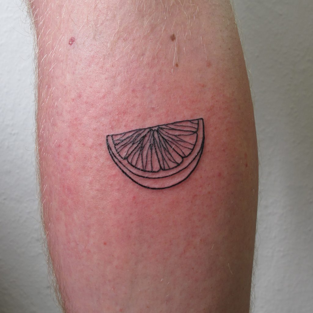 Linework lemon wedge tattoo, botanical tattooing