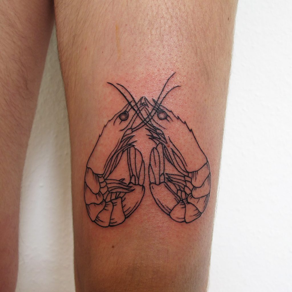 Tattoo of two shrimp arranged in heart shape in woodcuttattoo and lineworktattoo style