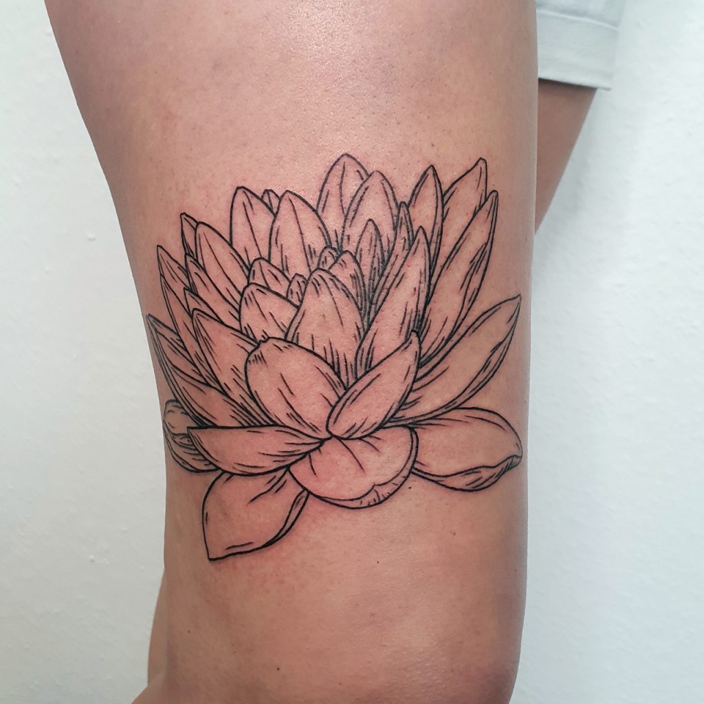 Water lily tattoo in lineworktattoo and woodcuttattoo style, botanical tattoo